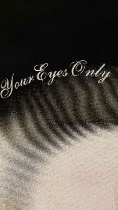 an image of the words your eyes only written on fabric