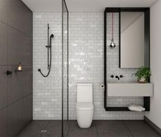 a white toilet sitting in a bathroom next to a sink