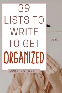 a person holding up a sign that says, 39 lists to write to get organized