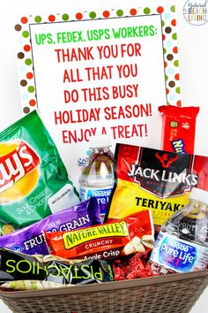 a basket filled with lots of candy next to a sign that says thank you for all that you do this busy holiday season enjoy a treat