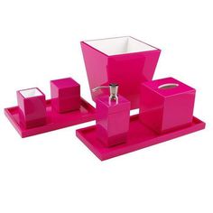 a pink bathroom set with soap dispenser and toothbrush holder in the shape of cubes