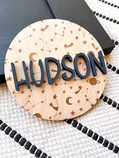 a wooden sign that says hudson on it