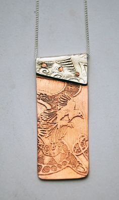 "This copper and silver Magpie necklace is made up of two etched and impressed pieces of metal and riveted together with handmade copper rivets.  The top part of this copper and silver Magpie pendant is made from sterling silver which has been impressed from an etched brass plate of my own hand drawn ink drawing.  The bottom part is etched with a flying magpie motif and polished to a mirror finish.  All my designs are original limited editions. supplied on sterling silver 16\" or 18\" curb chain Cold Connection Jewelry Ideas, Copper And Silver Jewelry, Etched Metal Jewelry, Jewelry Metalsmithing, Rivet Jewelry, Cold Connections, Etched Jewelry, Metal Jewellery, Etched Copper