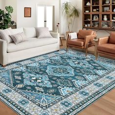 a living room filled with furniture and a blue rug