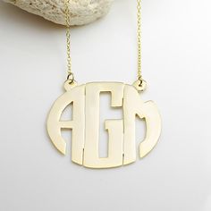 A beautiful handmade Block Monogram Necklace with your choice of any 1 or 3 letters. The necklace is made of sterling silver and then dipped in 14k gold to give the pendant a gold shiny finish. Included with this necklace is your choice of 14 inches to 18 inches, 14K gold plated chain. Available sizes: 7/8 Inch to 2 Inches wide Ships with in 2-3 weeks. (domestic) (add approximately 1 more week for international orders) Monogram Pendant, 3 Letter, Monogram Jewelry, Gold Monogram, Monogram Necklace, Personalized Monogram, Letter Necklace, Gold Plated Chains, The Money