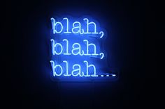 a blue neon sign that says bleah, blarh, blah