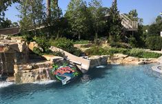 a water slide in the middle of a swimming pool