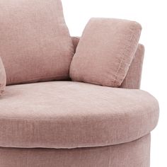 a round chair with two pillows on it's back and the seat upholstered