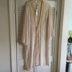 New With Tags. Light Weight Gauzy Fabric Robe. Blush Colored With Ecru Lace Trim. Elegant Long Sleeve Sleepwear For Vacation, Beige Summer Sleepwear For Vacation, Sheer Long Sleeve Sleepwear For Spring, Feminine Long Sleeve Summer Sleepwear, Elegant Lace Trim Sleepwear For Vacation, Casual Lace Summer Sleepwear, Beige Sleepwear For Spring, Casual Lace Sleepwear For Summer, Bohemian Summer Sleepwear With Lace Trim