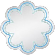 a white and blue flower shaped mirror