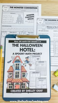 the halloween hotel activity book is displayed on a table with markers and pencils next to it