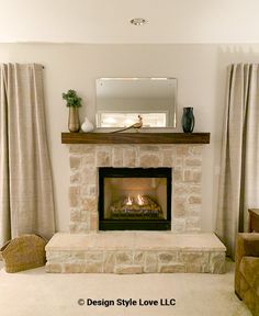 a living room filled with furniture and a fire place