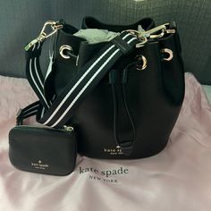 Nwtblack Kate Spade Mini Bucket Bag With Pink Dust Bag Detachable Strap With Coin Pouch (Coin Pouch Also Detachable) Silver Hardware Size: L- 7.75” X W: 10” Inside Is Spacious Pull Draw String With Magnetic Snap Dust Bag Size: W: 17.5” X L: 17.5” Black Kate Spade Bag With Adjustable Strap, Kate Spade Pouch Shoulder Bag With Detachable Strap, Kate Spade Bucket Shoulder Bag For Formal Occasions, Kate Spade Formal Bucket Shoulder Bag, Kate Spade Bucket Shoulder Bag With Detachable Strap, Kate Spade Bucket Bag For Everyday Use, Luxury Kate Spade Bucket Shoulder Bag, Kate Spade Everyday Bucket Bag, Everyday Kate Spade Bucket Bag