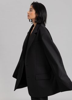 Color: Black Midweight traditional suiting fabric Oversized silhouette Longer length Padded shoulders Flap front pockets Front button closure Lined 70% Polyester 30% Wool Dry Clean By The Frankie Shop. Imported One Size The Frankie Shop, Suiting Fabric, Frankie Shop, Oversized Blazer, Oversized Silhouette, Black Blazers, Long Length, Duster Coat, Women's Blazer