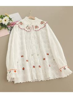 Material: COTTON Size Bust Size (CM) Bust Size (Inches) Length (CM) Length (Inches) One Size 110 43.31 64 25.20 Cotton Blouse With Floral Embroidery And Doll Collar, White Embroidered Top With Collar, White Blouse With Floral Embroidery And Peter Pan Collar, Spring Embroidered Tops With Doll Collar, Embroidered Tops With Doll Collar For Spring, Embroidered Doll Collar Top For Spring, White Embroidered Blouse With Peter Pan Collar, White Blouse With Floral Embroidery And Doll Collar, Cotton Embroidered Long Sleeve Top With Lace Trim