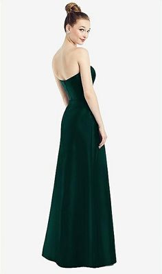 a woman in a long green dress looking back