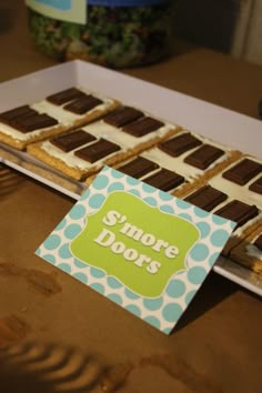 there is a box of short doors on the table with cookies in front of it