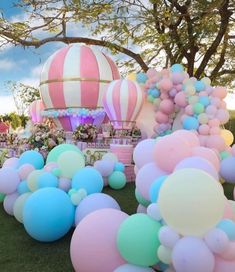 balloons and other decorations are on the grass