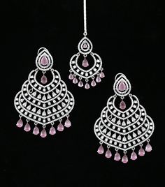 This beautiful Silver American Diamond Chandbali Earring Tikka set features silver tone Rhodium plating and is adorned with sparkling American diamonds. Perfect for Indian weddings, Bollywood fashion, Punjabi style Chandbali, and Pakistani weddings, this jewelry set will give you the perfect glamorous look. Diamond Chandbali, Indian Jhumka, Punjabi Style, Chandbali Earrings, Indian Weddings, Kundan Necklaces, Jhumka Earrings, Indian Bollywood, Cz Jewelry