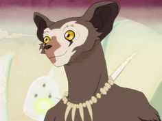 a cat with yellow eyes and a necklace around it's neck