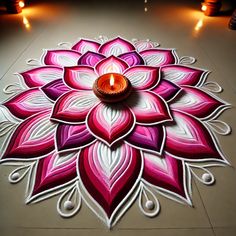 a decorated floor with a lit candle on it