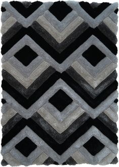 a black and grey rug with an abstract design on the bottom, it is made out of