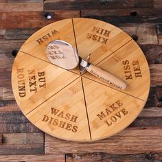 a clock made out of bamboo with words on the side and a knife stuck in it