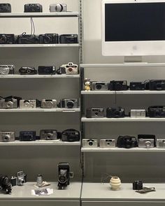 there are many cameras on display in the store