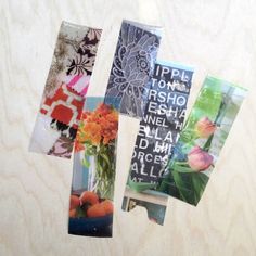 four different cards with flowers in them on a table