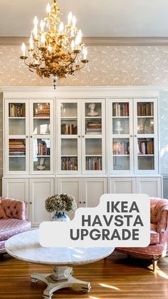 a living room filled with furniture and a chandelier