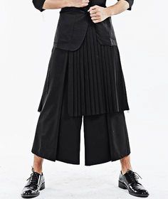 Dark Black Men's Pleats Wrap Skirt // Wear it with Drop Crotch Pants – Ofelya Boutique Baggy Pleated Skirt For Fall, Baggy Cotton Pleated Skirt, Tailored Black Cotton Pants, Black Pleated Bottoms For Workwear, Fall Black Pleated Bottoms, Black Pleated Bottoms For Fall, Black Pleated Pants For Spring, Spring Black Pleated Pants, Black Wide-leg Pleated Pants