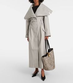 Find JACQUEMUS Le Trench Caruso Oversized Trench Coat on Editorialist. Material: 35% polyester, 34% cotton, 29% wool, 2% elastane. Care instructions: dry clean. Made in Portugal. Designer color name: Light Grey. Quarter-lined. Lining: 48% cotton, 47% acetate, 5% elastane. Closure: concealed buttoned front. Pockets: flap pockets. Sleeves: long-sleeved. Length: full length. Detachable belt. Belt loops. Chic Oversized Gabardine Outerwear, Luxury Oversized Outerwear For Fall, Luxury Oversized Fall Outerwear, Luxury Cotton Outerwear For Winter, Elegant Oversized Cotton Outerwear, Luxury Cotton Outerwear For Spring, Oversized Luxury Spring Outerwear, Luxury Oversized Outerwear For Spring, Oversized Trench