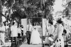 the bride and groom are walking down the aisle