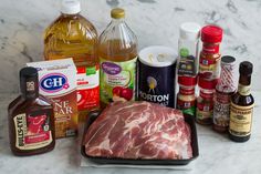 meat, spices and condiments on a marble counter top