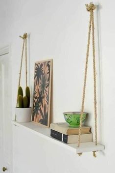 a shelf with books and pictures on it