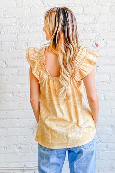 Flutter into spring in style with this bohemian dream of a top. Its cotton blend fabric feels featherlight against your skin as you sway in the warm breeze. Delicate ruffles and an empire waist give it an ethereal quality, while the square neckline and short flutter sleeves keep it flirty. Whether you're dancing at a music festival or strolling through the Saturday market, this top moves with you. Let the vibrant print transport you to exotic lands as you pair it with cutoffs for a casual look o Rachel Clark, There She Goes, Styling Guide, New Inventory, Flutter Sleeve Top, Boho Print, Printed Linen, Flutter Sleeves, Top Sales