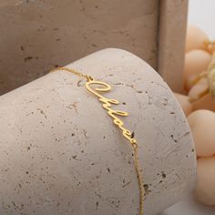 Custom Name Bracelet Gold 14k, Dainty Name Bracelet, Layering Bracelet, Personalize Name Jewelry for Women, Baby Name Bracelet, Gift for Her Materials: High Quality 925 Sterling Silver Finish: 14K Gold Vermeil - A thick layer of 14K gold over high-quality sterling silver. It does not tarnish like gold-plated or gold-filled jewelry. Chain Lengths: *4 inches: Ideal for toddlers or very young children. Perfect for a snug fit on petite wrists. *5 inches: Best for small children, offering a comfortab Elegant Name Bracelet For Gifting, Yellow Gold Adjustable Name Chain Bracelet, Adjustable Yellow Gold Chain Bracelet With Name, Custom Name Yellow Gold Chain Bracelet, Adjustable, Adjustable 14k Gold Birthday Bracelets, Adjustable 14k Gold Bracelets For Birthday, Adjustable 14k Gold Bracelet For Birthdays, Adjustable Yellow Gold Bracelet For Birthday Gift, Adjustable Yellow Gold Bracelets For Birthday Gift