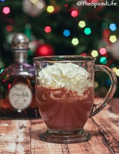 hot chocolate and whipped cream in a glass mug