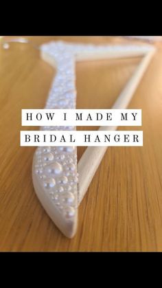 A white pearlescent hanger covered in various sized white pearls Bridal Hangers Personalized Diy, Diy Bridal Hangers, Diy Wedding Hangers, Bride Hangers, Wedding Personalization, Hangar Wedding, Pearl Hanger, Pearl Look, Bride Hanger