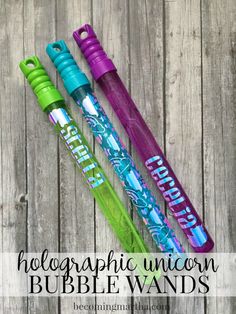 three different types of bubble wands sitting on top of a wooden table