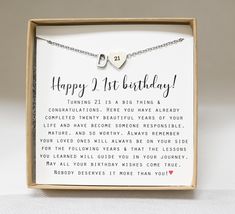 a birthday card in a box with a heart on the front and an inscription that reads, happy 1st birthday