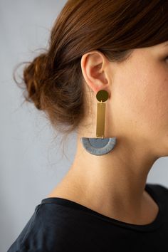 I have designed the pieces in this collection to be easy to wear with anything. I wanted to focus on the shapes and composition of the pieces themselves as opposed to the stitches on them. These earrings are made from Grey cotton which has been interfaced to provide structure. I have bound the edges in a band with matching embroidery thread in Grey. This is joined to a brass bar which is hung from a brass circle with a gold plated earpost. All findings are Gold Vermeil and I have enamelled the b Handmade Modern Geometric Earrings, Modern Handmade Geometric Earrings, Modern Handmade Long Drop Linear Earrings, Modern Handmade Earrings, Modern Linear Drop Earrings For Jewelry Making, Matching Embroidery, Brass Bar, Hammered Gold, Earrings Drop