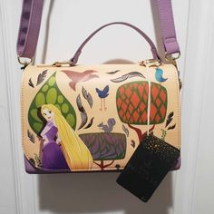 --Brand New W/ Tags --Such A Cute Bag For Any Disney Fan --Very Spacious --Paint Style Art On The Front --Pascal Interior Print --Strap Is Adjustable Disney Style Gift Bag, Rectangular Shape, Disney Rectangular Shoulder Bag For Daily Use, Disney Rectangular Shoulder Bag For Everyday Use, Disney Rectangular Shoulder Bag For Travel, Disney Style Rectangular Shoulder Bag For Travel, Trendy Rectangular Bags For Disney Trips, Themed Rectangular Bags For Daily Use, Themed Purple Travel Bags, Themed Multicolor Rectangular Bag