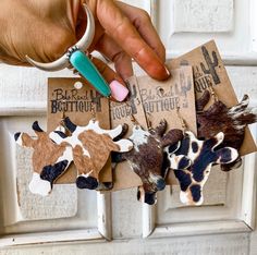 "Perfect for everyday wear! Add western vibes to your next outfit! Goldtone Genuine cowhide cow head shaped genuine leather earrings Earring size is about 2.15\" in length and about 2.50\" wide Please note that this is real cowhide and leather and there can be small defects. Know that I take pride in using the best picked for my products." Cow Leather Earrings, Western Girl Gifts, Western Jewelry Earrings, Western Leather Earrings, Cow Jewelry, Cowhide Earrings, Western Things, Cow Stuff, Cow Earrings