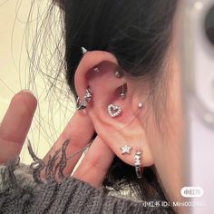 a person with ear piercings on their ears