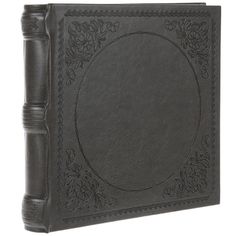 a black leather book with an ornate design on the front and sides, is shown