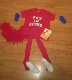 a child's red shirt with the words fox in socks on it