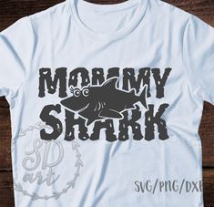 a t - shirt with the words mommy shark on it, and an image of a shark