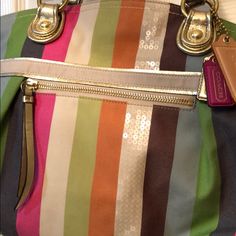 Hard To Find Legacy Bag Multicolor Double Handle Shoulder Bag With Gold-tone Hardware, Elegant Multicolor Coach Bag, Multicolor Coach Pouch Bag, Luxury Multicolor Shoulder Bag For On-the-go, Coach Multicolor Travel Bag, Coach Multicolor Tote Shoulder Bag, Coach Multicolor Shoulder Bag With Detachable Handle, Coach Multicolor Travel Satchel, Multicolor Coach Bag With Zipper Closure