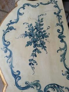 an ornate blue and white table with gold trim